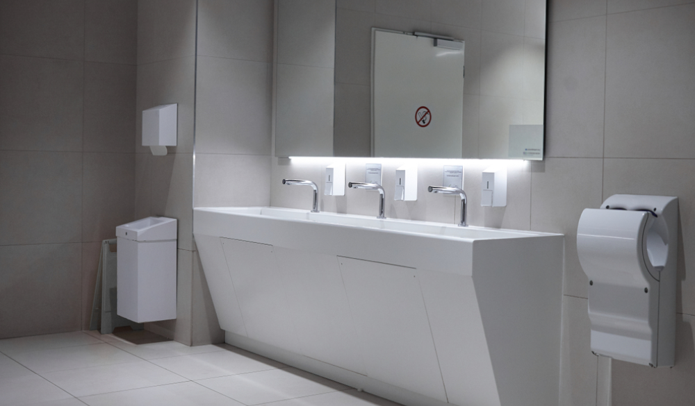 public washroom with hand dryers and paper towel dispensers 