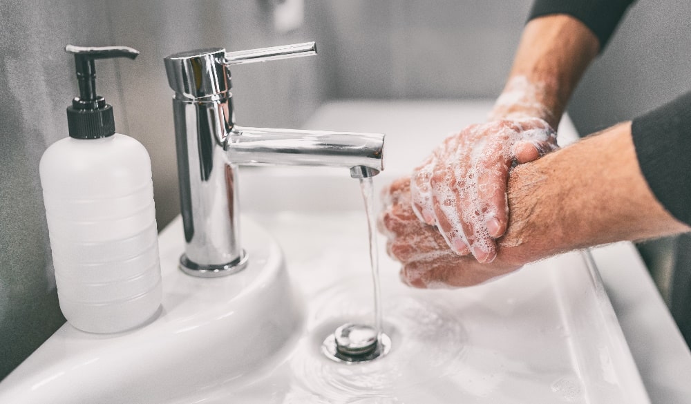 Man washing hands at sink