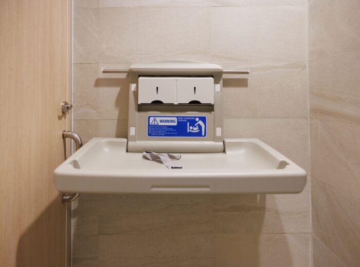 Baby-changing unit in commercial washroom