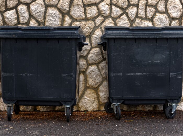 Black bin for general waste stood outside