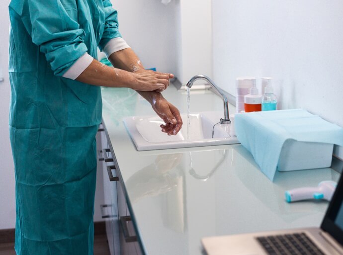 Individual in a healthcare facility washing their hands