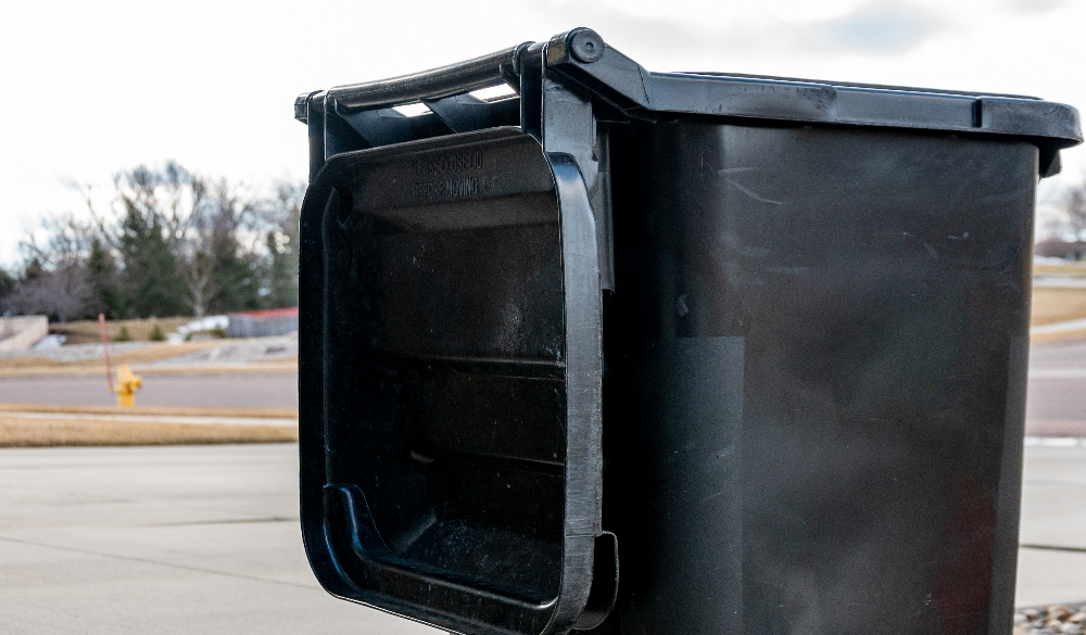 Commercial black bin used for general waste outside