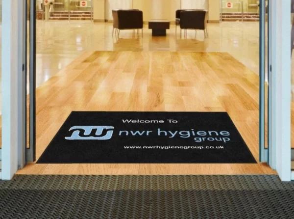 An NWR Hygiene dust control mat at the entrance to a business premises.